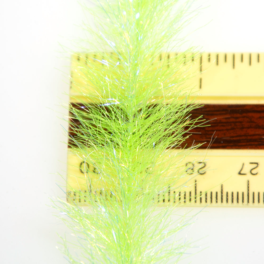 Flash Blend Baitfish Brush in Fluorescent Chartreuse over a white background on a ruler to show the width of the brush