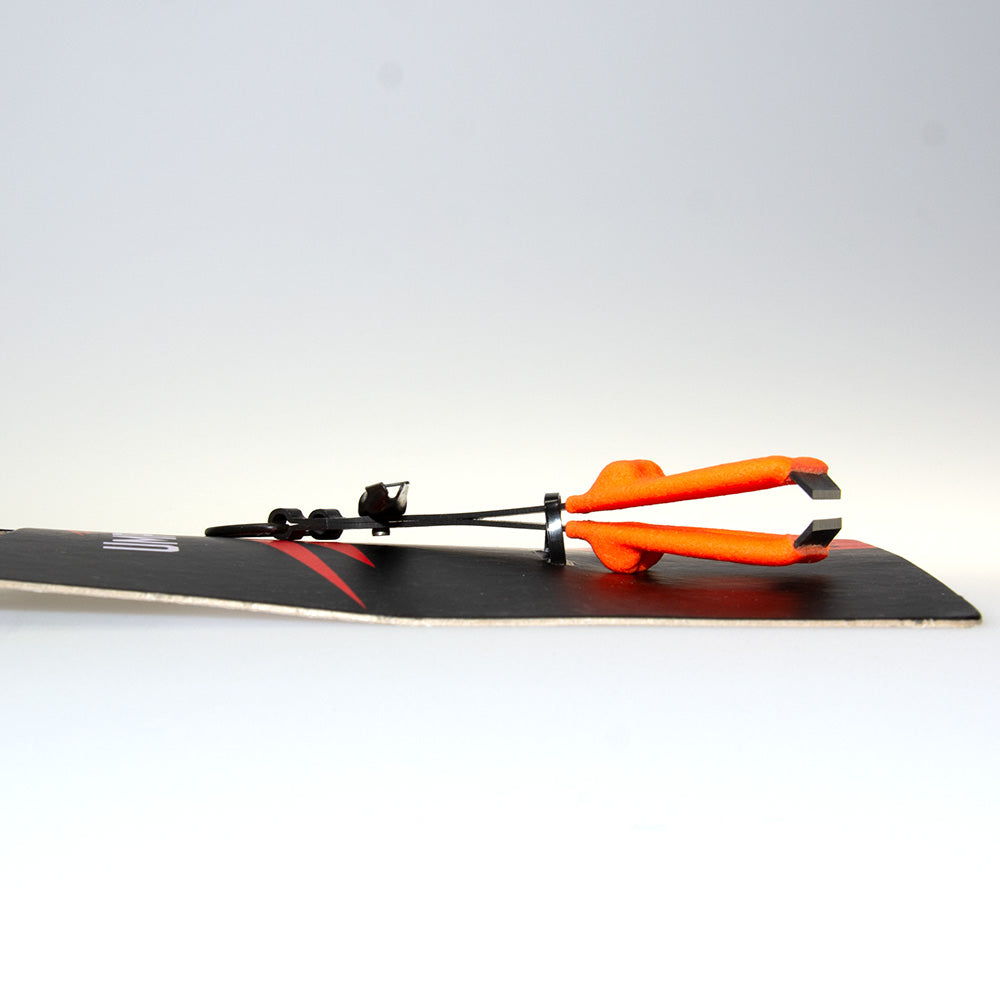 Umpqua River Grip Nipper and Knot Tool showing the easy grip in orange side view on a white background