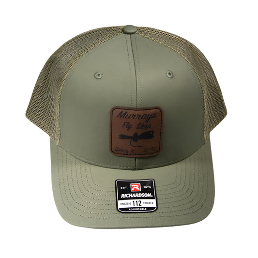 Loden Richardson 112 Cap on a white background with a leather popping bug patch