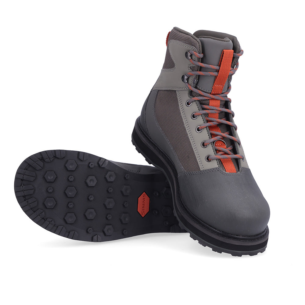 A pair of Simms Tributary Boots are shown on a white background - Murray's Fly Shop