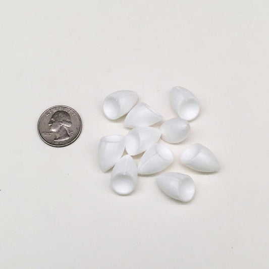 Popper bodies shown in comparison to a quarter.  These bodies are used for building your own popping bugs fly tying.