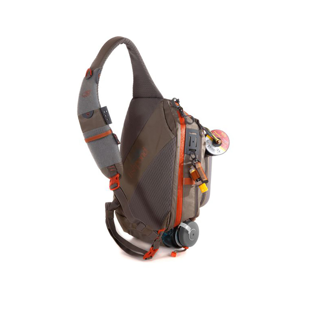 Summit Sling pack in Granite shown with tools and accessories from the back showing a net holder pouch, sling strap with attachment points and waist strap