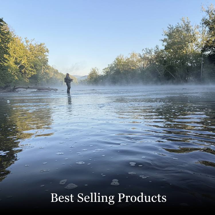 Fly fisherman wading in a misty river at dawn surrounded by lush trees — Murray's Fly Shop Best Selling Products collection