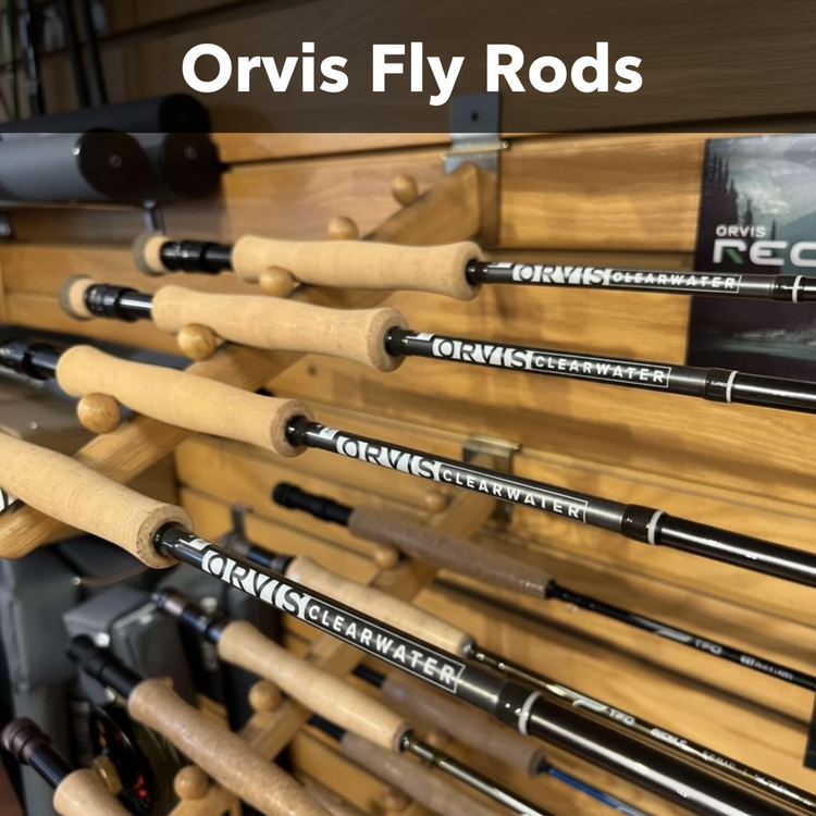  Orvis Clearwater fly rods with cork grips displayed on a wooden rod rack — Orvis Fly Rods at Murray's Fly Shop