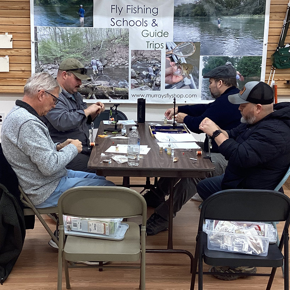 Brandon teaching fly tying 101 to our students