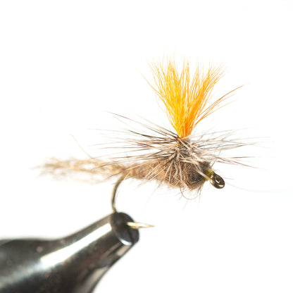 Close-up view of the Baltz Dry Para Nymph dry fly tied on a hook, showing the specialized tying materials