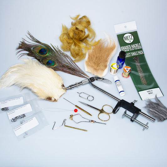 Murray's Basic Fly Tying Kit with c-clamp vise, fly tying scissors, bobbin, hackle pliers, dubbing needle, head cement, fly tying hooks, buck tail, Metz feathers and various threads to help any beginner get started in fly tying.