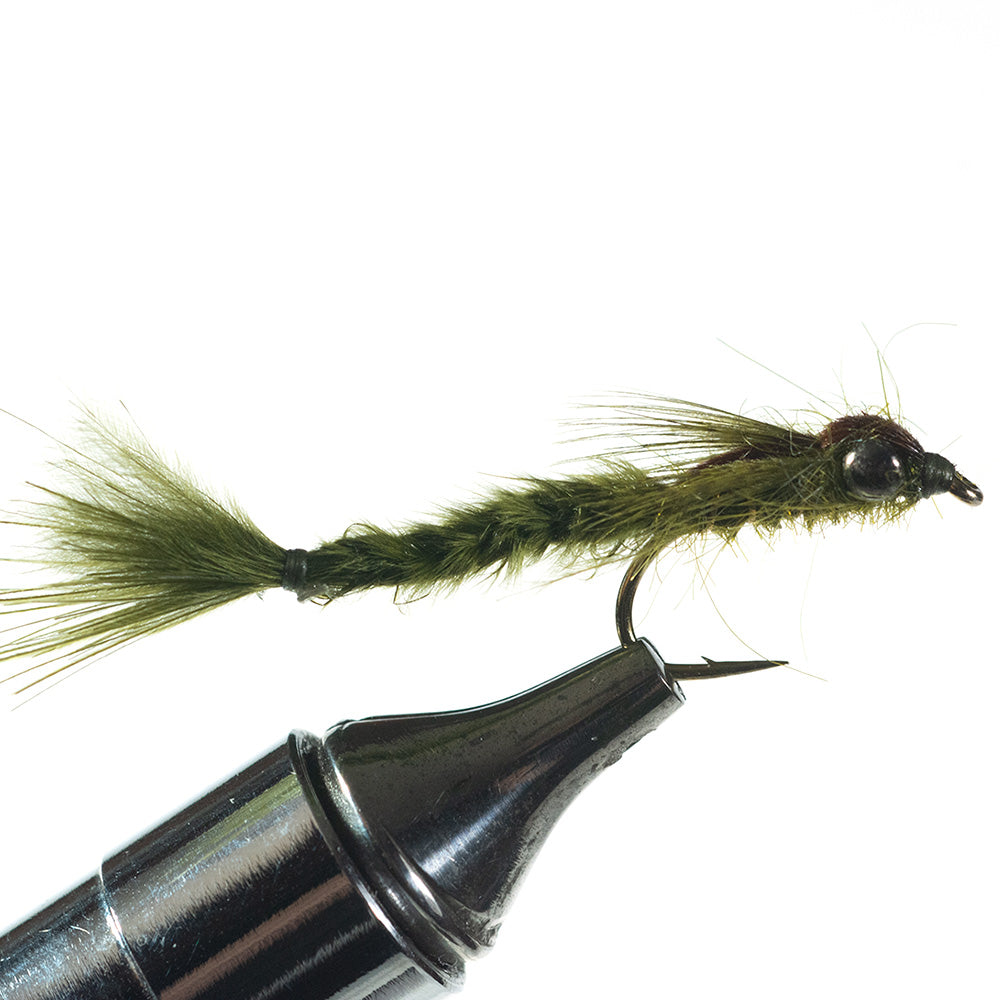 Olive Damselfly Nymph fly in a fly tying vise on a white background