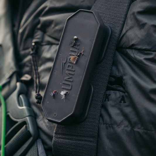 Magnetic fly dock holding multiple fishing flies neatly in place