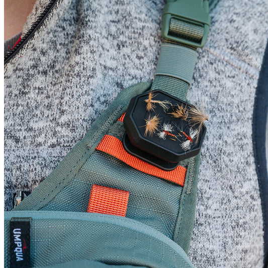 Low-profile LINK™ HatchPad magnetic fly dock mounted on a base station, holding multiple fishing flies securely with edge-to-edge magnets for quick access.
