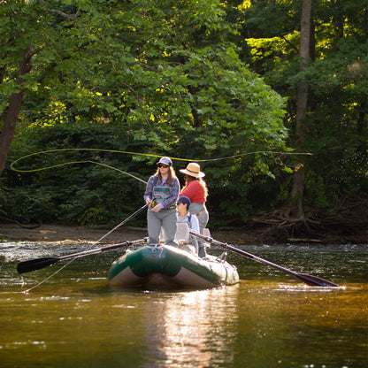 Two anglers on a boat fly fishing with an Orvis Freshwater Fly Fishing Rod
