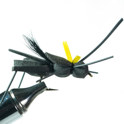 Project Cricket Bass Terrestrial Topwater fly shown from the side in a fly tying vise