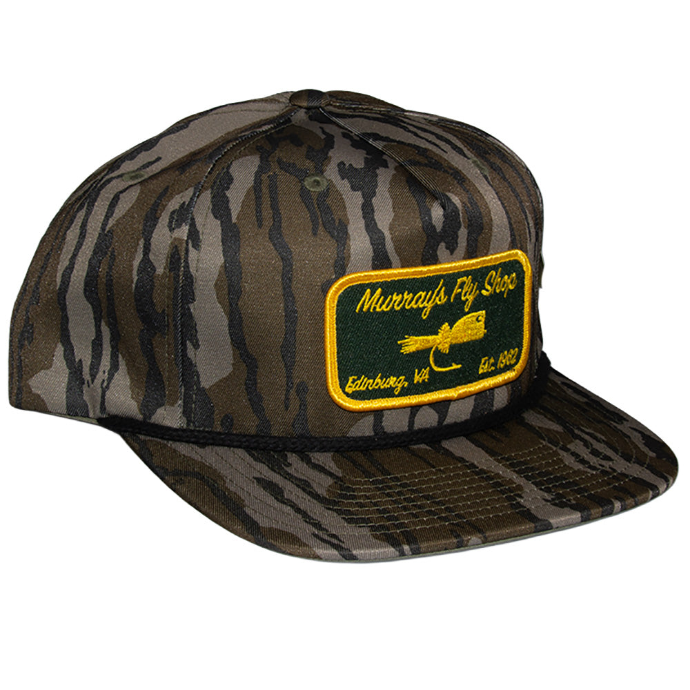 Murray's Fly Shop Richardson 256p Mossy Oak hat featuring a popper on a patch