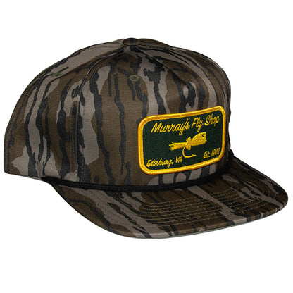 Murray's Fly Shop Richardson 256p Mossy Oak hat featuring a popper on a patch
