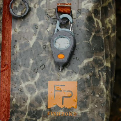 "Fishpond Riverkeeper Digital Thermometer with IPX7 waterproof rating and aluminum probe for fly fishing stream temperature monitoring.