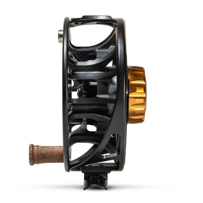 Ross Animas Reel, Matte black, side view showing the ported spool for, drag knob and handle all on a white background