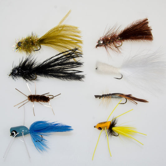An assortment of bass streamers, nymphs, crayfish and popper patterns to fish on low water bass rivers at the end of summer