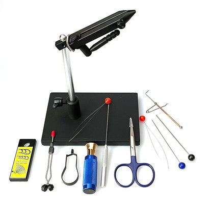 Griffin Montana Pro II Fly Tying vise with black pedestal base and an array of fly tying tools laid out on a black surface including scissors, a bobbin, a red threader, a blue hair stacker, and bodkin.