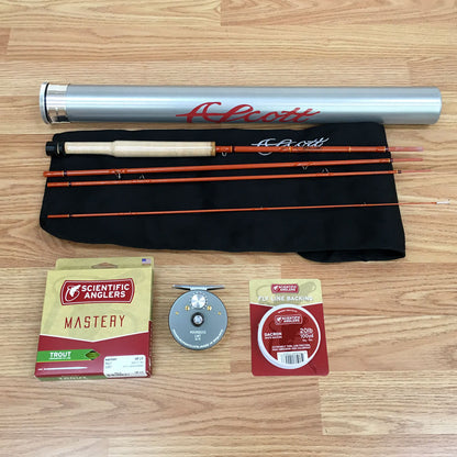 Scott F Series 622/4 fiberglass fly rod showing the handcrafted fly rod in four pieces, cork grip, Scientific Anglers Fly Line, Hardy Marquis Reel, Fly Line Backing and high quality aluminum fly rod tube