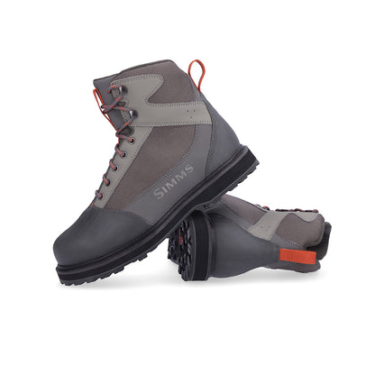 A pair of Simms Tributary Fly Fishing Wading Boots are shown on a white background - Murray's Fly Shop