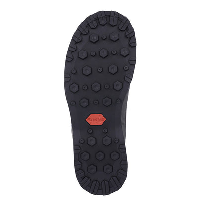 A Simms Tributary Boot sole is shown on a white background - Murray's Fly Shop