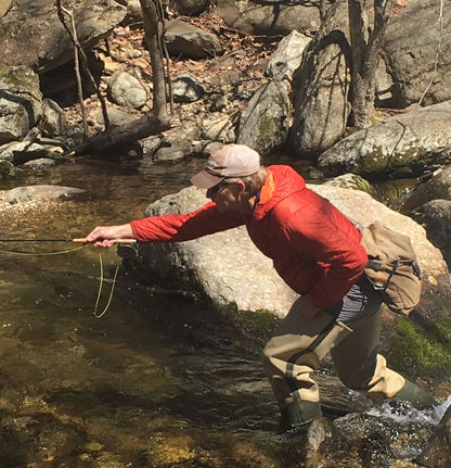 Bull Frogg Hippers worn by an angler fishing in a rocky stream
