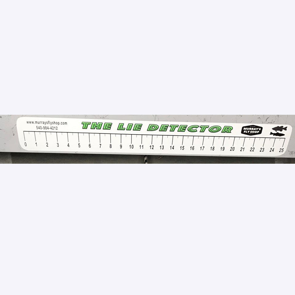 Lie Detector Sticker shown on a fishing boat box this is a ruler that measures up to 25 inches
