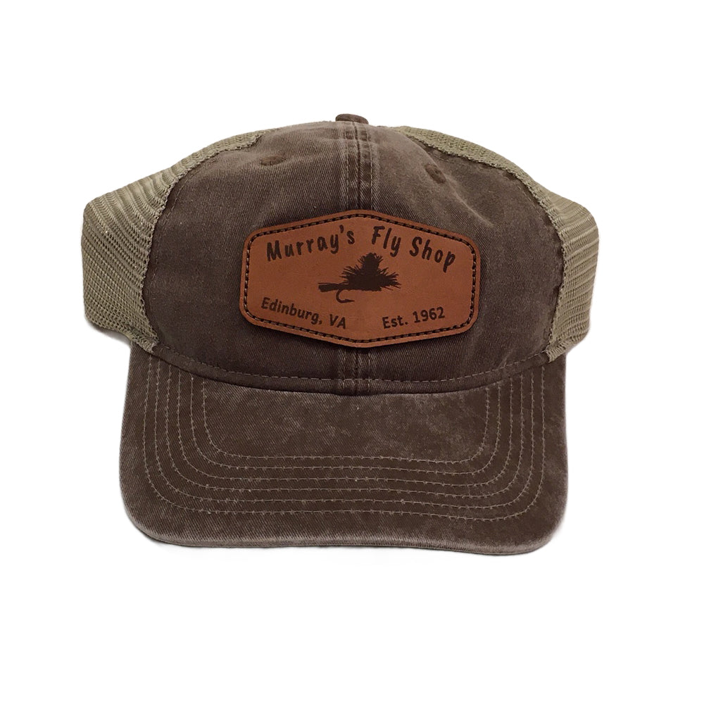 Murray's Fly Shop Leather Patch on a Brown Hat with a mesh back which is tan in color