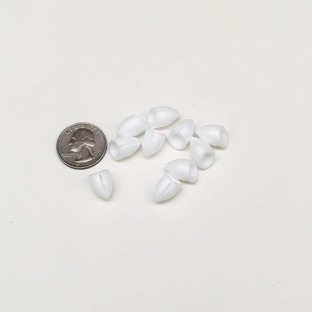Popper bodies shown in comparison to a quarter.  These bodies are used for building your own popping bugs fly tying.