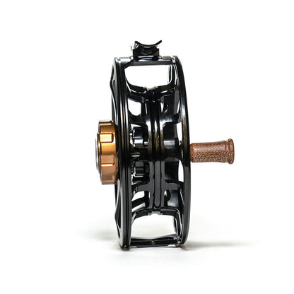 Ross Evolution LTX Fly Fishing Reel view from the side of the reel showing the drag knob and handle along with the arbor knot channel and ported frame of the spool