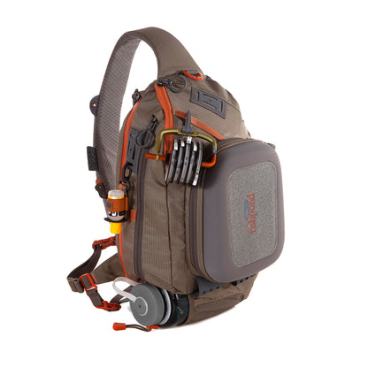 Fishpond Summit Sling Pack shown from the front with accessories attached on a white background