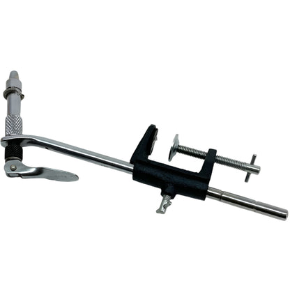 Close-up of a Terra Pro Super AA fly tying vise with hardened steel jaws holding a hook, showing the adjustable C-clamp base and cam-action lever.