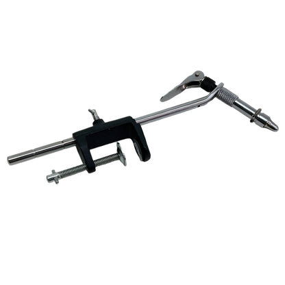 Close-up of a Terra Pro Super AA fly tying vise with hardened steel jaws holding a hook, showing the adjustable C-clamp base and cam-action lever.