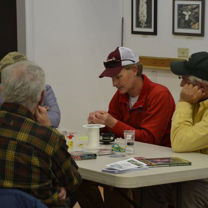 Jeff Murray teaching students in Fly Casting and Rigging 101 Class on how to put backing, fly line and leaders on a fly reel including a knot tying demonstration