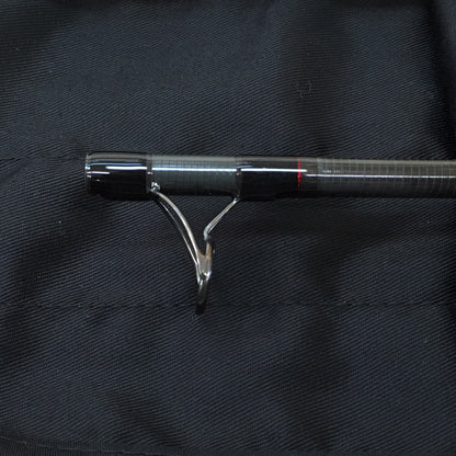 A stripping guide on a Scott Centric Fly Rod is shown in this picture with the rod sock as a background